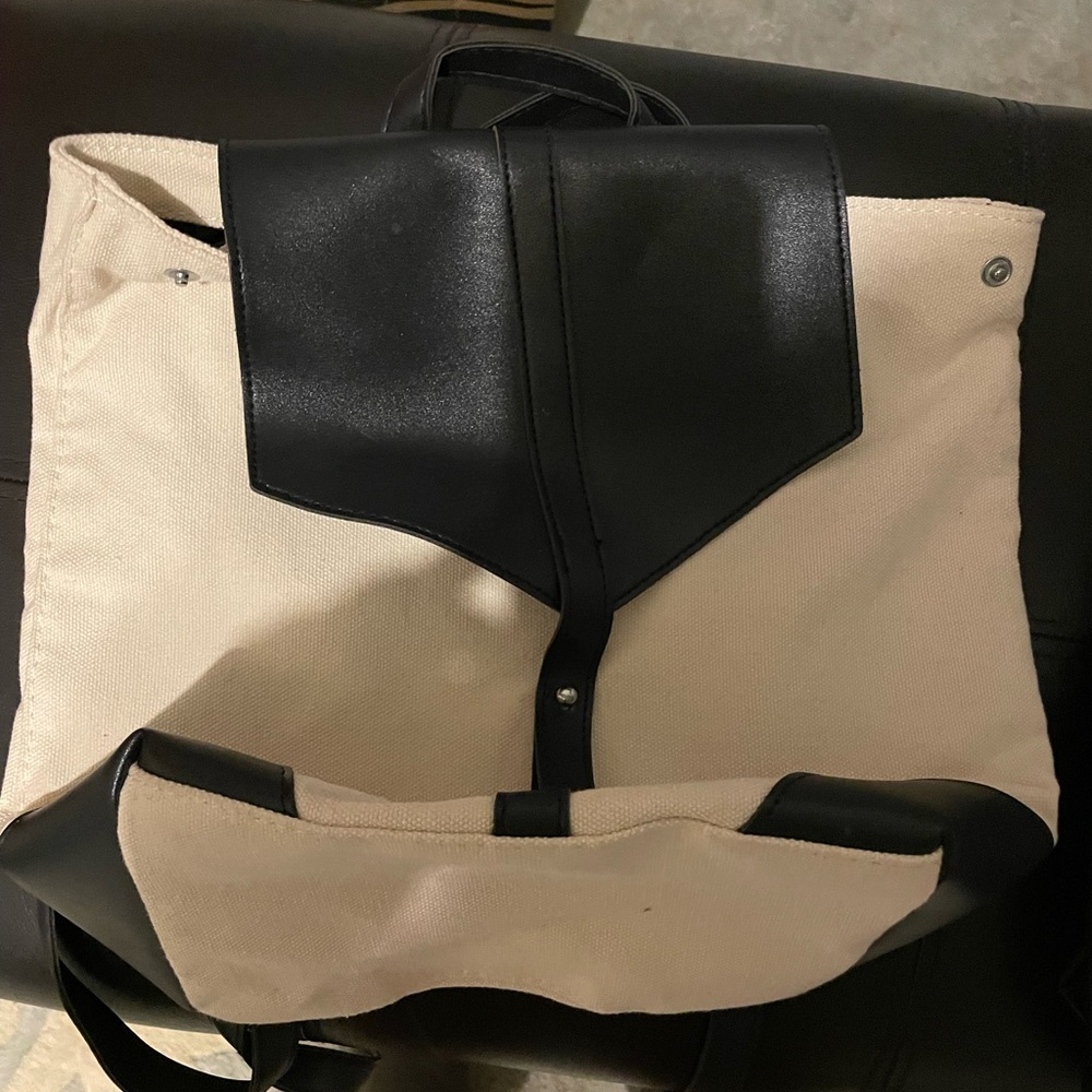 Black faux leather and canvas backpack